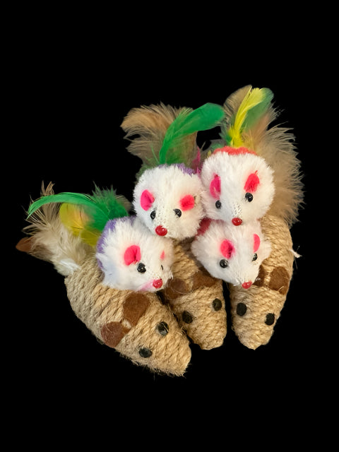Cat toys resembling mice with feathers on a dark surface