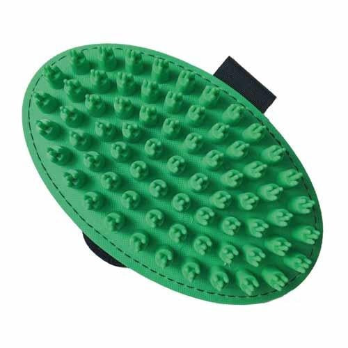 Green grooming brush with textured surface on a white background