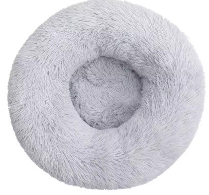 Fluffy gray donut-shaped pet bed on a white background