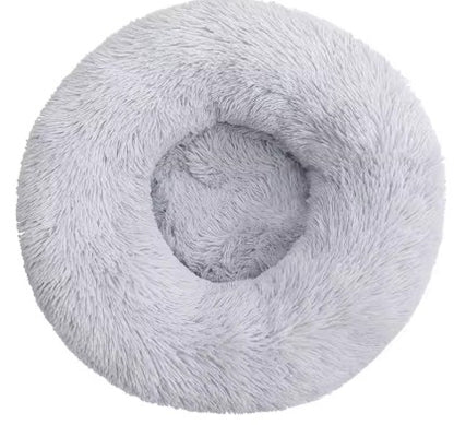 Fluffy gray donut-shaped pet bed on a white background